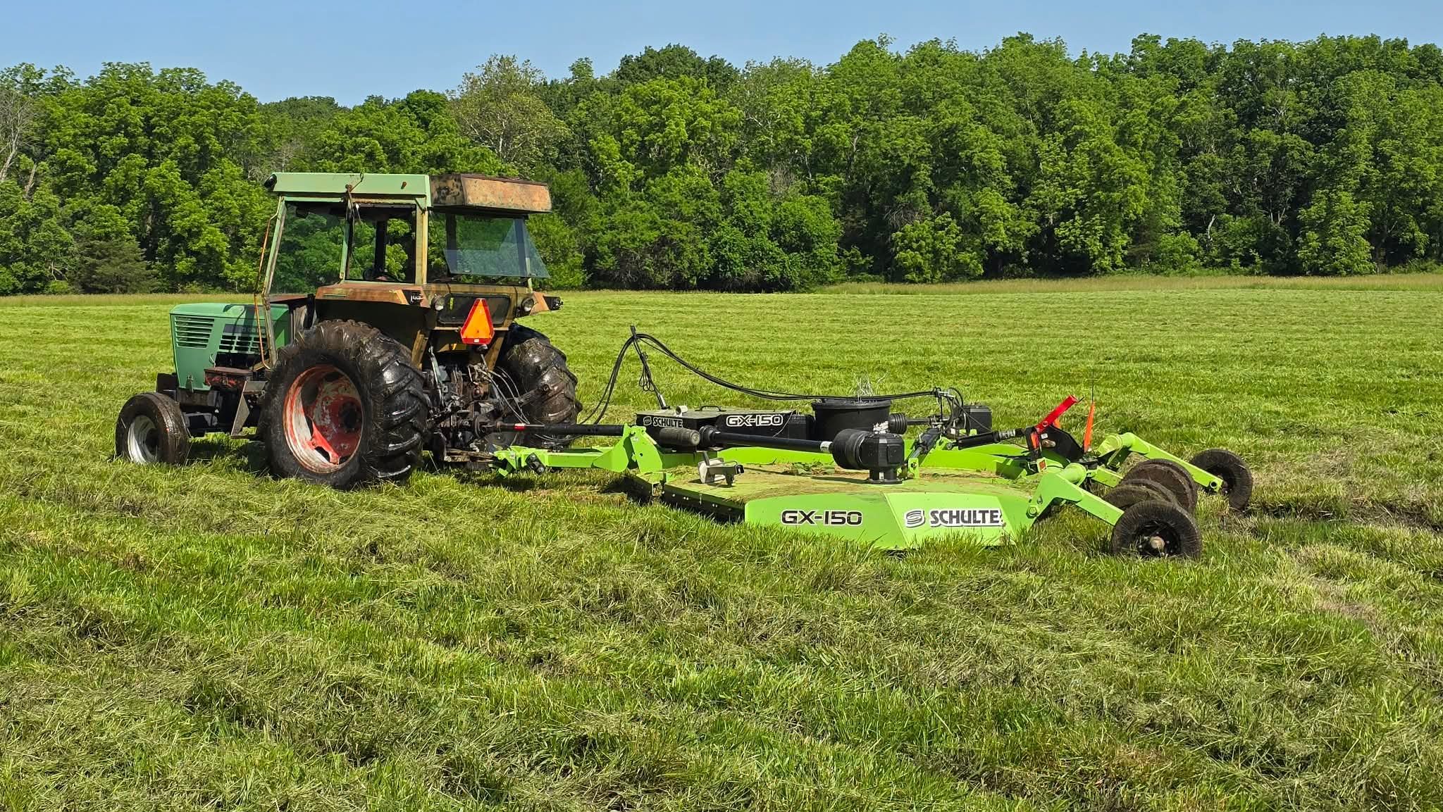 Side and rear view of the actual tractor and wide rotary cutter